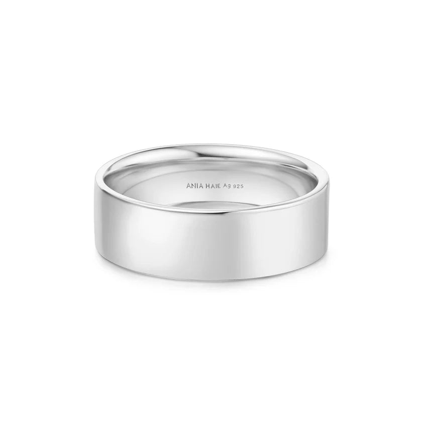 Silver ring with 'ANIA HAI' engraving on a white background